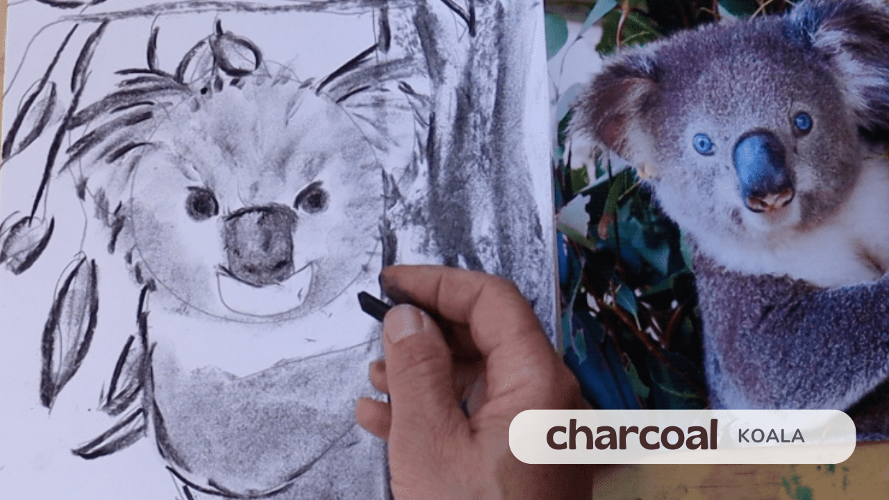 Artist drawing a realistic wolf face using charcoal on paper.
