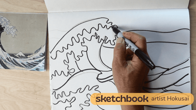 Hand drawing a detailed wave sketch in a sketchbook with a marker.
